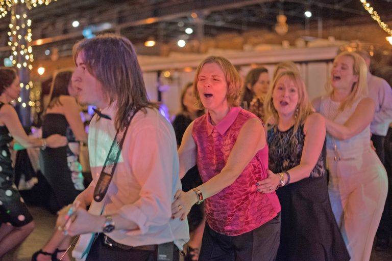 ladies doing the conga at a party