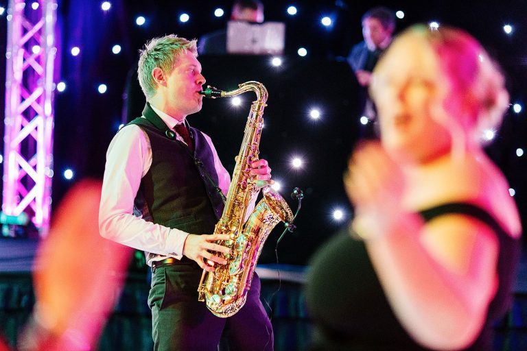 sax player with lady dancing