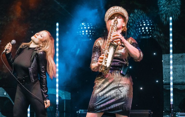 Saxophone and singer performing