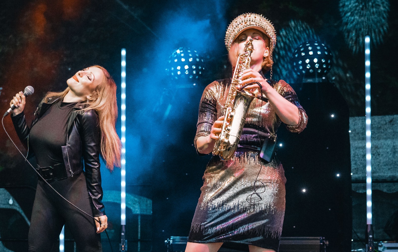 Saxophone and singer performing