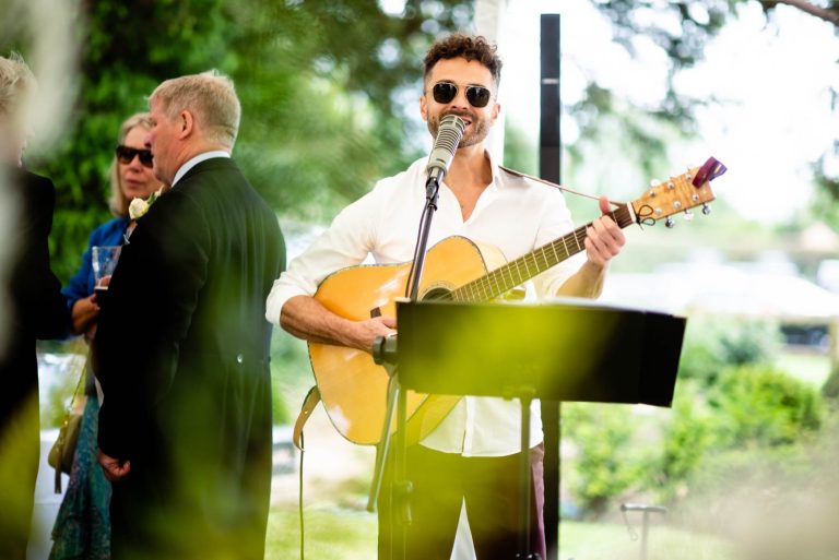 Singer performing playing guitar