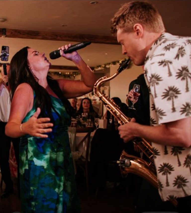 singer and saxophone on the dance floor